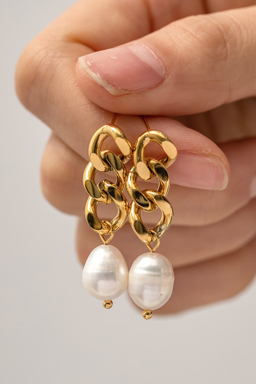 Gold plated pearl earrings detail